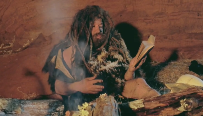 Stone Age Person Reading a book